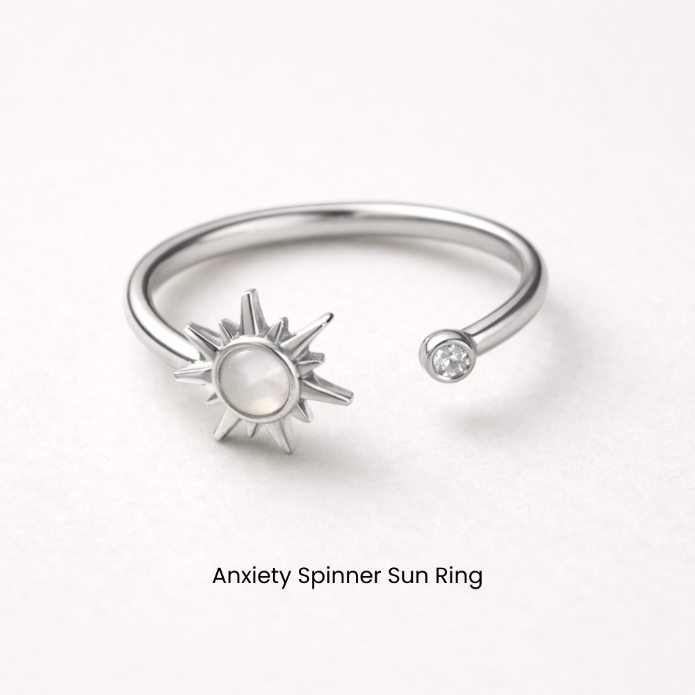 Silver anxiety spinner sun ring on a white background