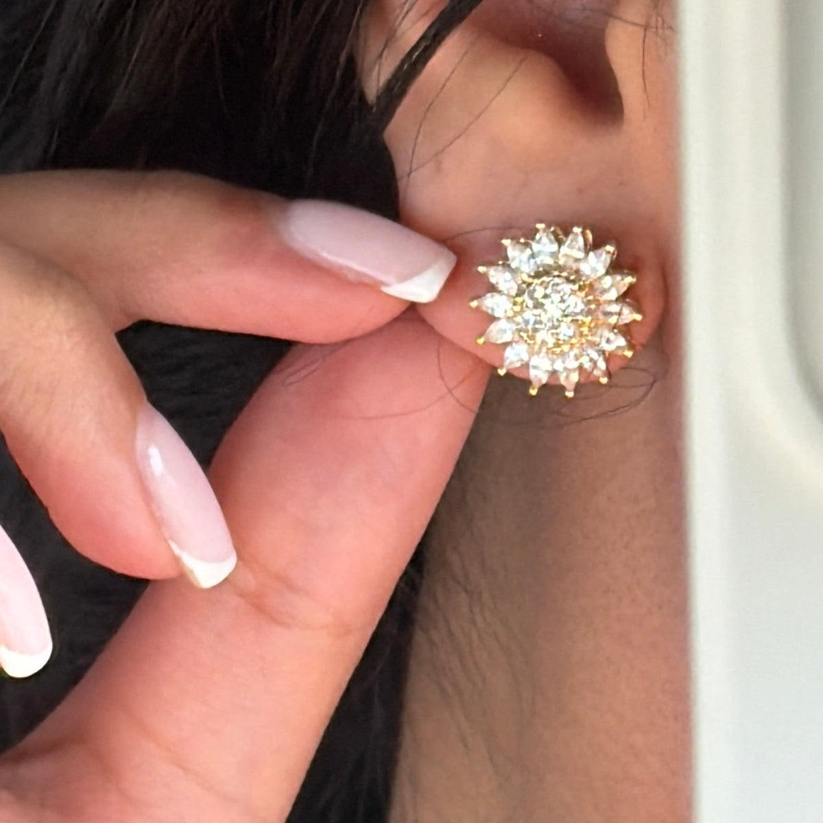 Stressy protea earings brass lifestyle image.